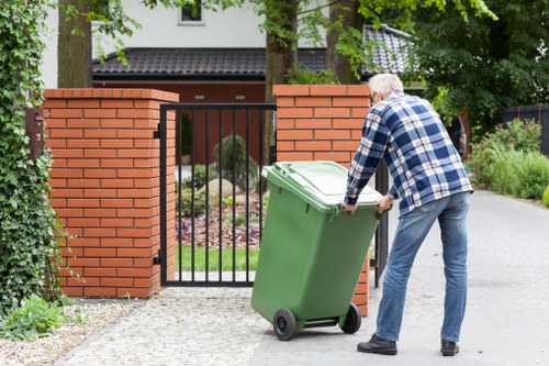 Supervisor conducting risk assessment on a commercial waste job